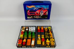 Matchbox - Hot Wheels - A plastic Hot Wheels carry case containing 24 Matchbox diecast model cars