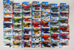 Hot Wheels - A carded collection of 47 Hot Wheels diecast model vehicles from various ranges.