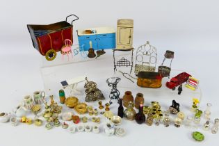 Wells O London - Other - A collection of vintage dolls house accessories including tea sets, pots,