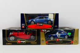 Bburago - Three boxed diecast 1:18 scale model cars from Bburago.