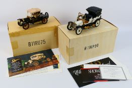 Franklin Mint - 2 x boxed cars, a 1912 Packard Victoria and a 1910 Cadillac Model 30 Roadster.