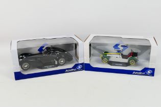 Solido - Two boxed diecast 1:18 scale model cars from Solido.