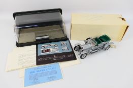 Franklin Mint - A Rolls Royce Silver Ghost with display case.