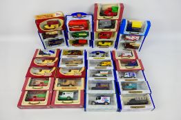 Oxford Diecast - A collection of 33 Diecast Metal replica vehicles including Christmas 1998,