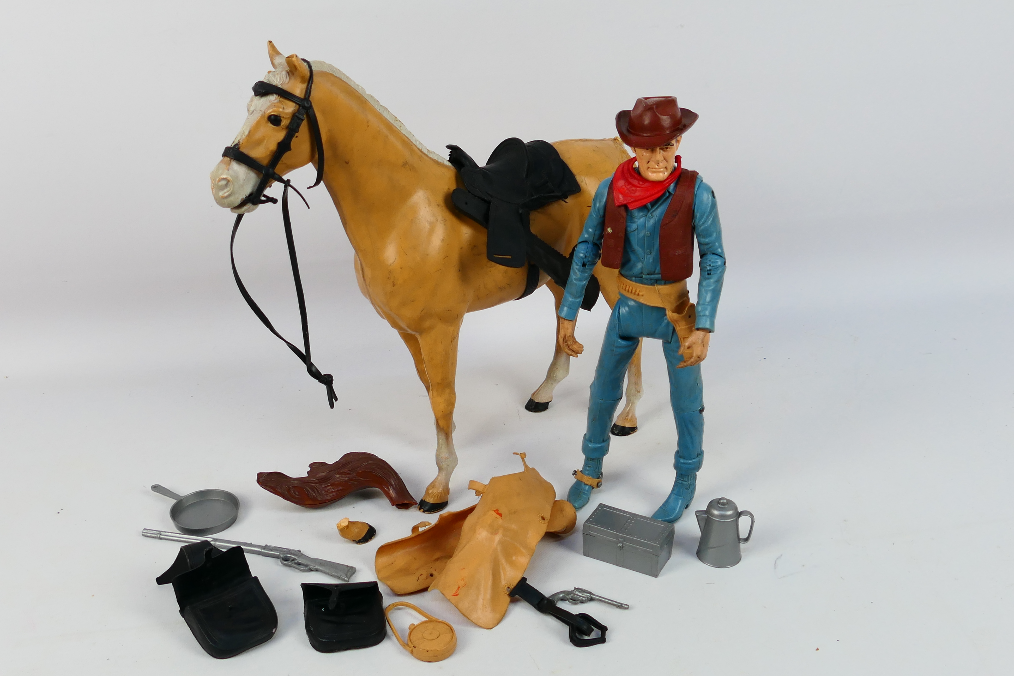 Johnny West - An unboxed vintage Johnny West Cowboy Kit comprising of a 12" cowboy poseable action