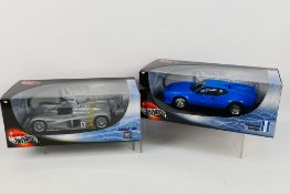 Hot Wheels - Two boxed '100% Hot Wheels' 1:18 scale diecast model cars.