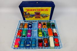 Matchbox - A Matchbox collectors Min-case containing 22 diecast vehicles in varying condition.