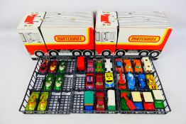 Matchbox - Two Matchbox carry cases - one EMPTY whilst one contains 29 Matchbox vehicles mainly