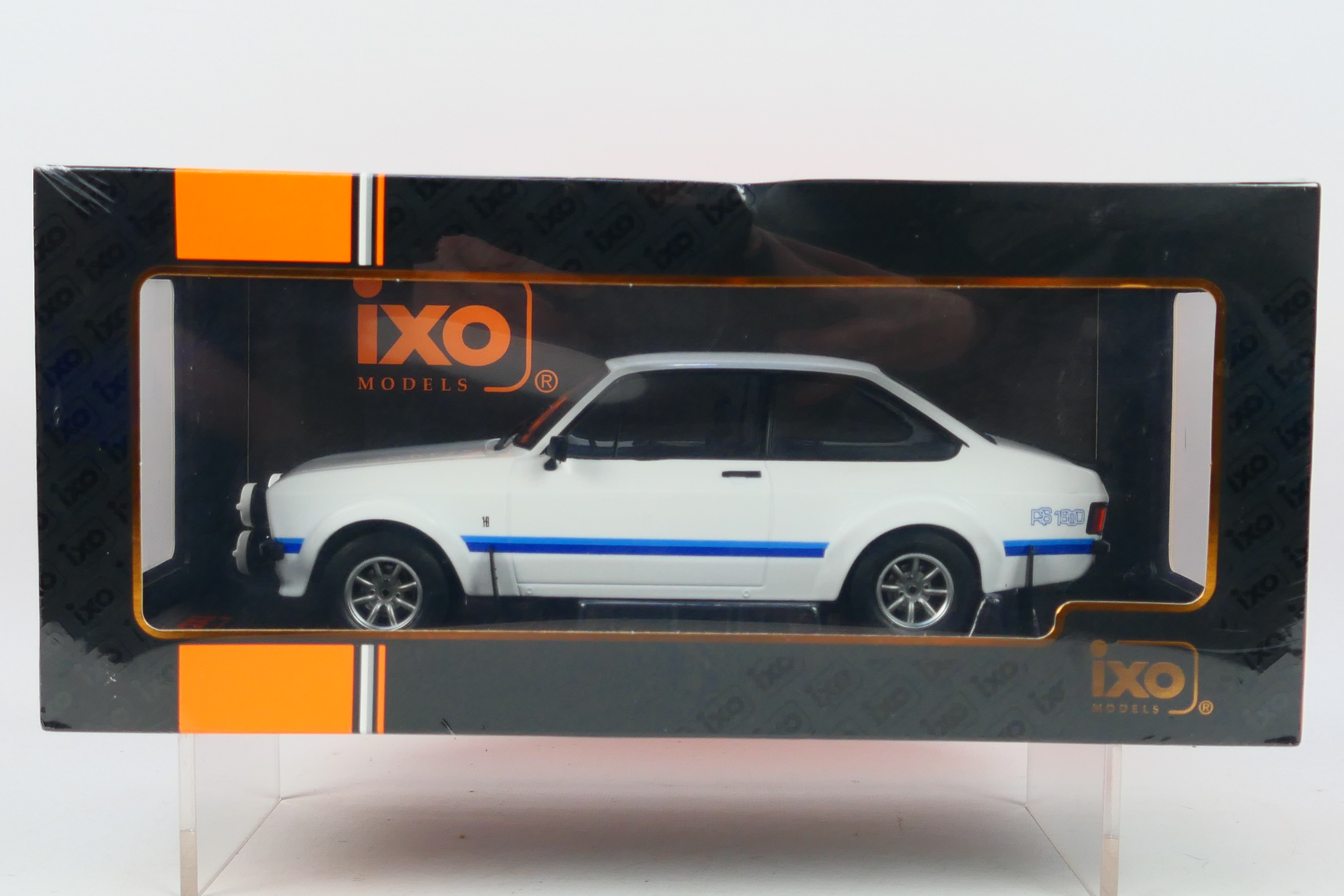 IXO Models - A boxed 1:18 scale IXO Models #18CMC029 1977 Ford Escort MK.II RS1800.