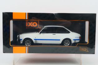 IXO Models - A boxed 1:18 scale IXO Models #18CMC029 1977 Ford Escort MK.II RS1800.