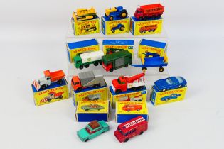 Matchbox - 12 x boxed models including Ford Tractor # 39, Hay Trailer # 40, Caterpillar Dozer # 18,