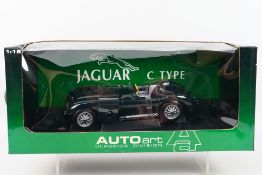 AutoArt - A boxed AutoArt #725034 1:18 scale Jaguar C-Type.