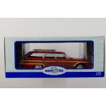 Model Car Group - A boxed 1:18 scale Model Car Group MCG18074 Ford Country Squire with roof rack.