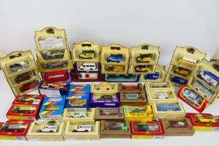 Corgi - Lledo - Bburago - Matchbox - Over 40 boxed diecast model vehicles in several scales.