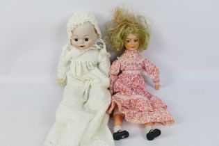 Unknown Maker - Porcelaine - Dolls - A pair of unboxed porcelain dolls in excellent condition.