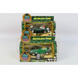 Scalextric - 2 x boxed slot cars, a Vanwall # C.097 and a BRM # C.098.