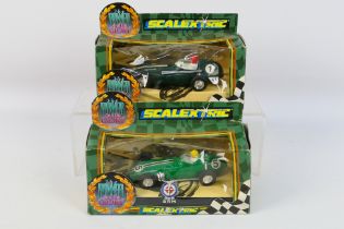 Scalextric - 2 x boxed slot cars, a Vanwall # C.097 and a BRM # C.098.