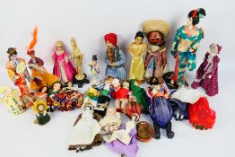 Unknown Maker - A collection of dolls in national costume, some composite,