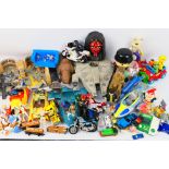 Kenner - Hasbro - Galoob - Tyco - Others - An assortment of unboxed vintage action figures and toys.