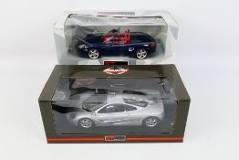UT Models - Two boxed 1:18 scale diecast model cars from UT Models,