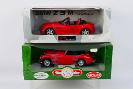 Britains Collectibles (Ertl) - UT Models - Two boxed diecast 1:18 scale model cars.