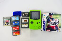 Nintendo - An unboxed Nintendo Game Boy Colour # CGB-001 with 3 x games cartridges.