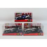 SCX - Three boxed 1:32 scale F1 slot cars.