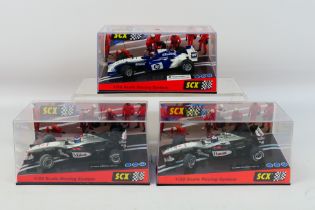 SCX - Three boxed 1:32 scale F1 slot cars.