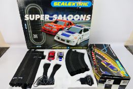 Scalextric - Hornby - A Super Saloons Scalextric set (#C1016) and Track extension pack B (#C8035).
