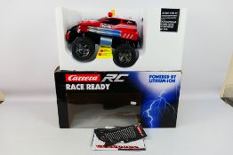 Carrera - A boxed Carrera RC 1:14 scale 'Fire Fighter Watergun' vehicle.