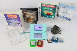 Nintendo - An unboxed Nintendo DS Lite model with power lead, 8 x games and a game card case.