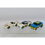 Matchbox - An unboxed trio of three Matchbox Powertrack 1:64 scale slot cars,