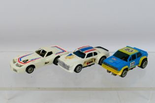 Matchbox - An unboxed trio of three Matchbox Powertrack 1:64 scale slot cars,