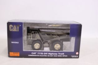 Norscot NZG - A boxed Commemorative 1:50 scale CAT 777D quarry dump truck in polished metal finish