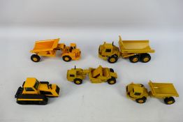 Ertl - Joal - A group of unboxed construction vehicles, CAT D25D articulated dumper,