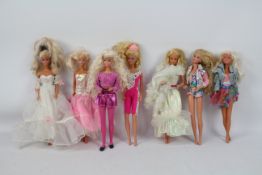 Mattel - Barbie - A collection of 7 x Barbie dolls including one in a wedding dress.