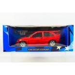 UT Models - A boxed 1:18 scale UT Models #180082102 Ford Escort Cosworth.