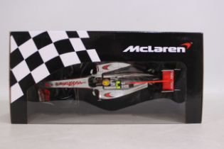 Minichamps - A 1:18 scale McLaren Mercedes MP4-25 2010 Lewis Hamilton car # 530 101802.