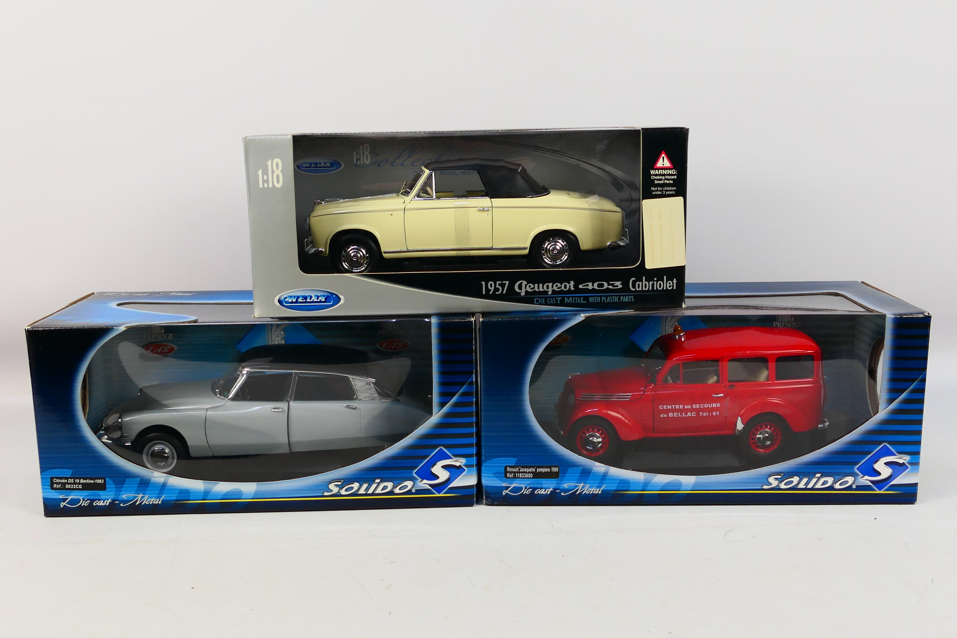 Solido - Welly - Three boxed diecast 1:18 scale model cars.