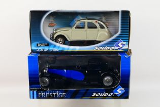 Solido - Two boxed diecast 1:18 scale model cars from Solido,