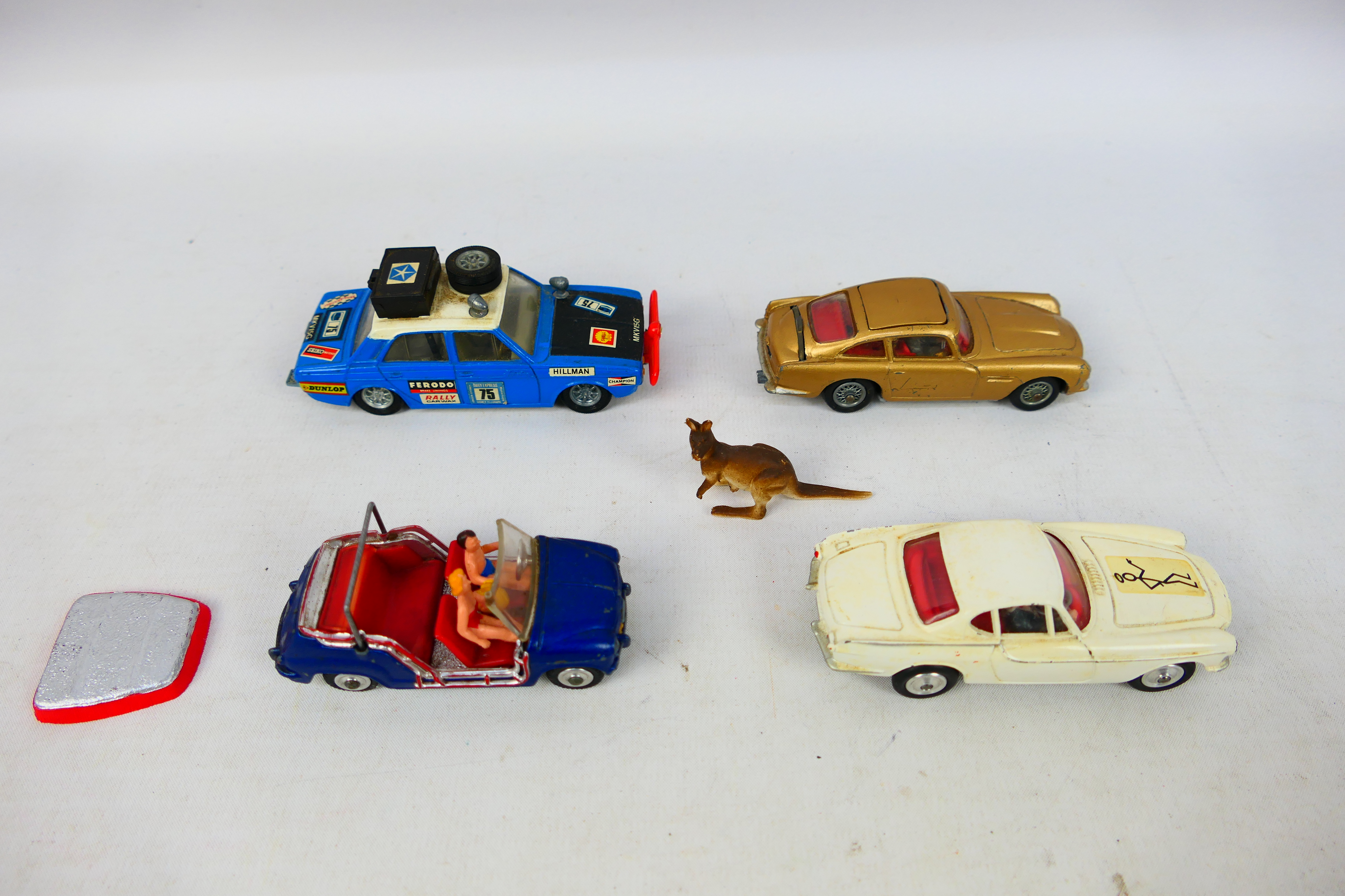 Corgi Toys - Four unboxed diecast model cars from Corgi Toys.