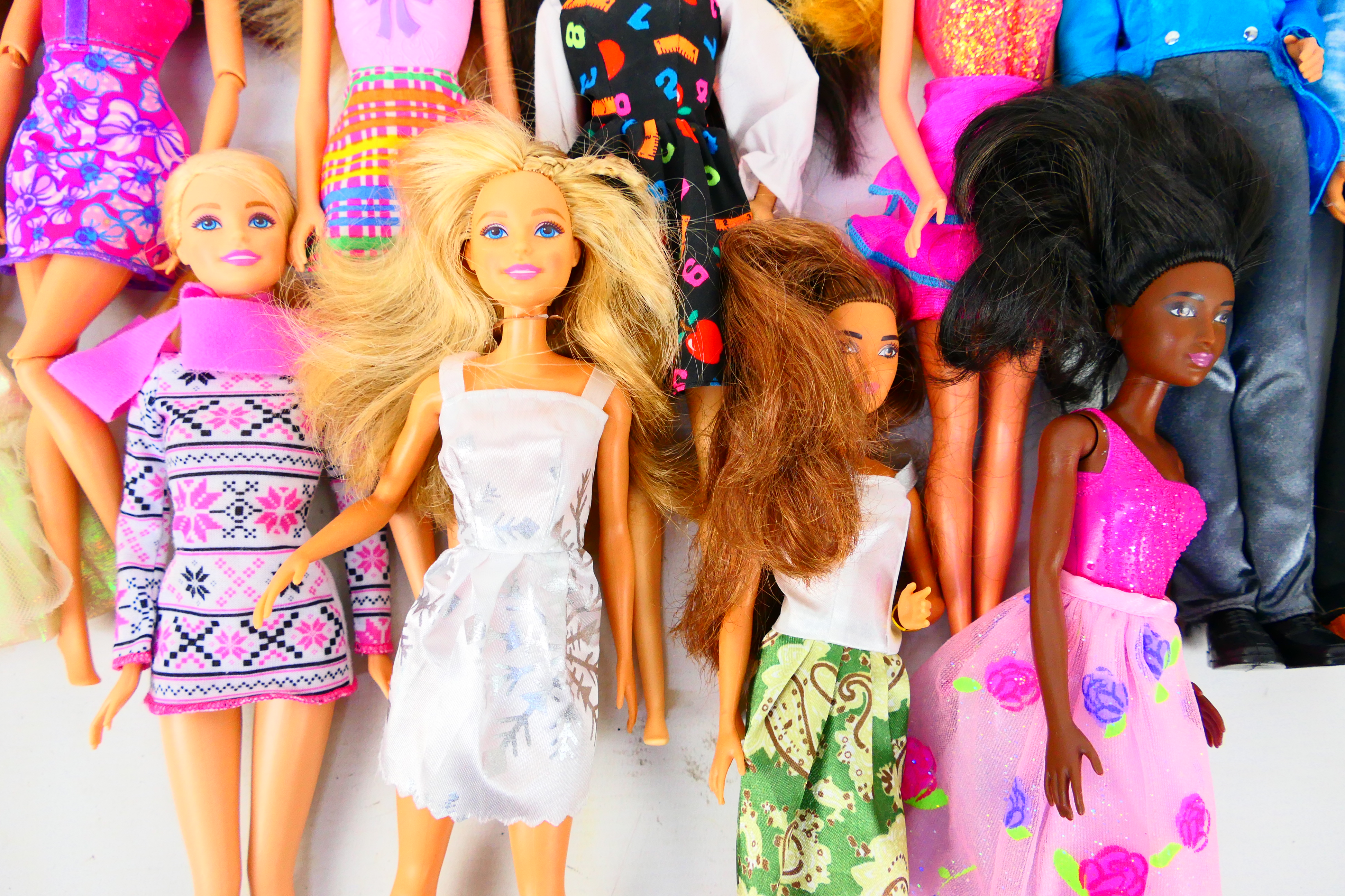 Mattel - Barbie - Ken - An unboxed collection of 11 modern Barbie dolls, in a variety of outfits. - Image 2 of 4