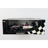 Minichamps- A boxed 1:18 scale European Minardi Cosworth PS03 Jos Verstappen car which appears Mint