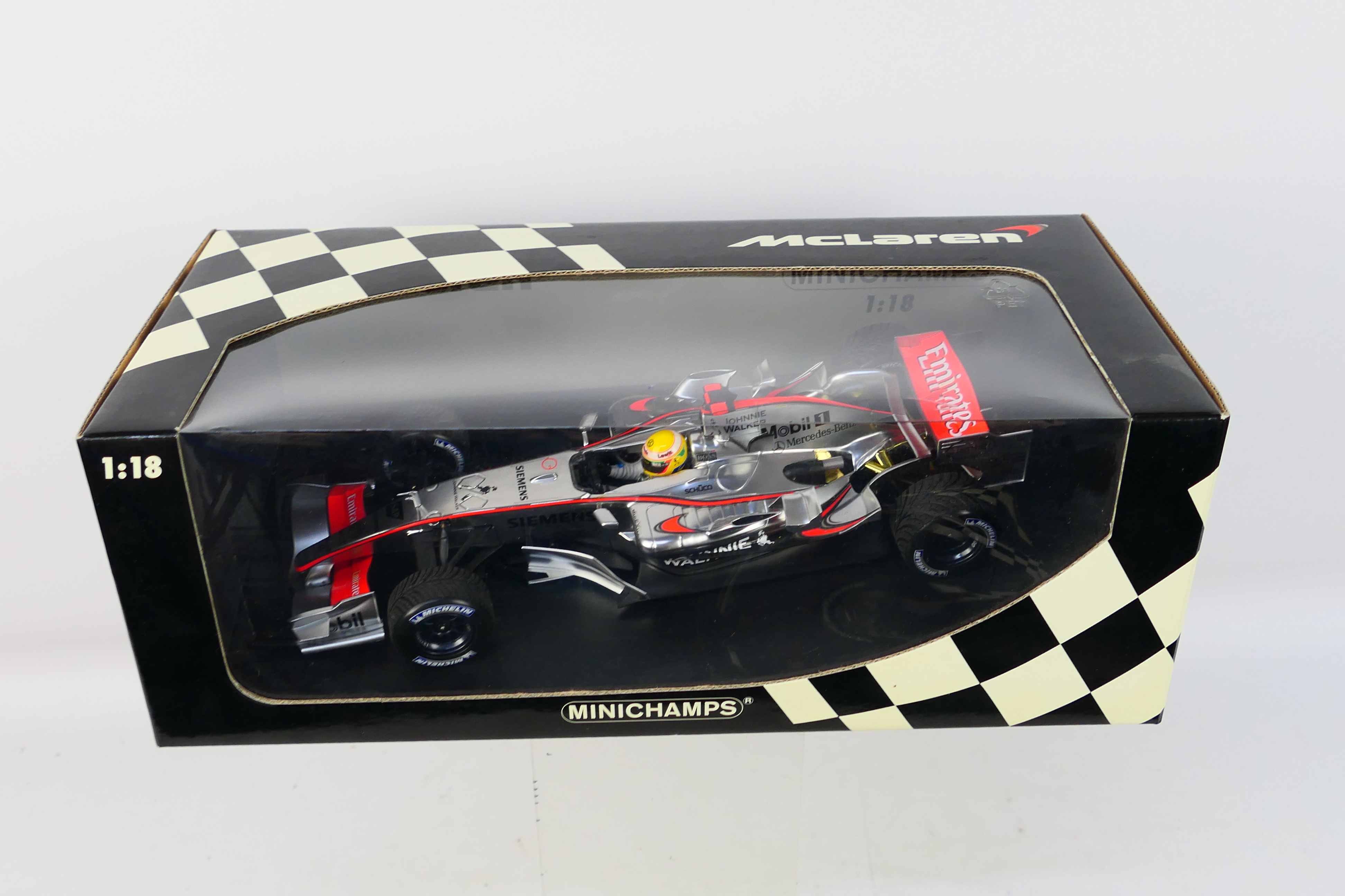 Minichamps - A boxed limited edition 1:18 scale McLaren Mercedes MP4-21 Lewis Hamilton 1st roll out - Image 3 of 3