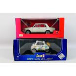 Revell - IST Models - Two boxed 1:18 scale diecast model vehicles.