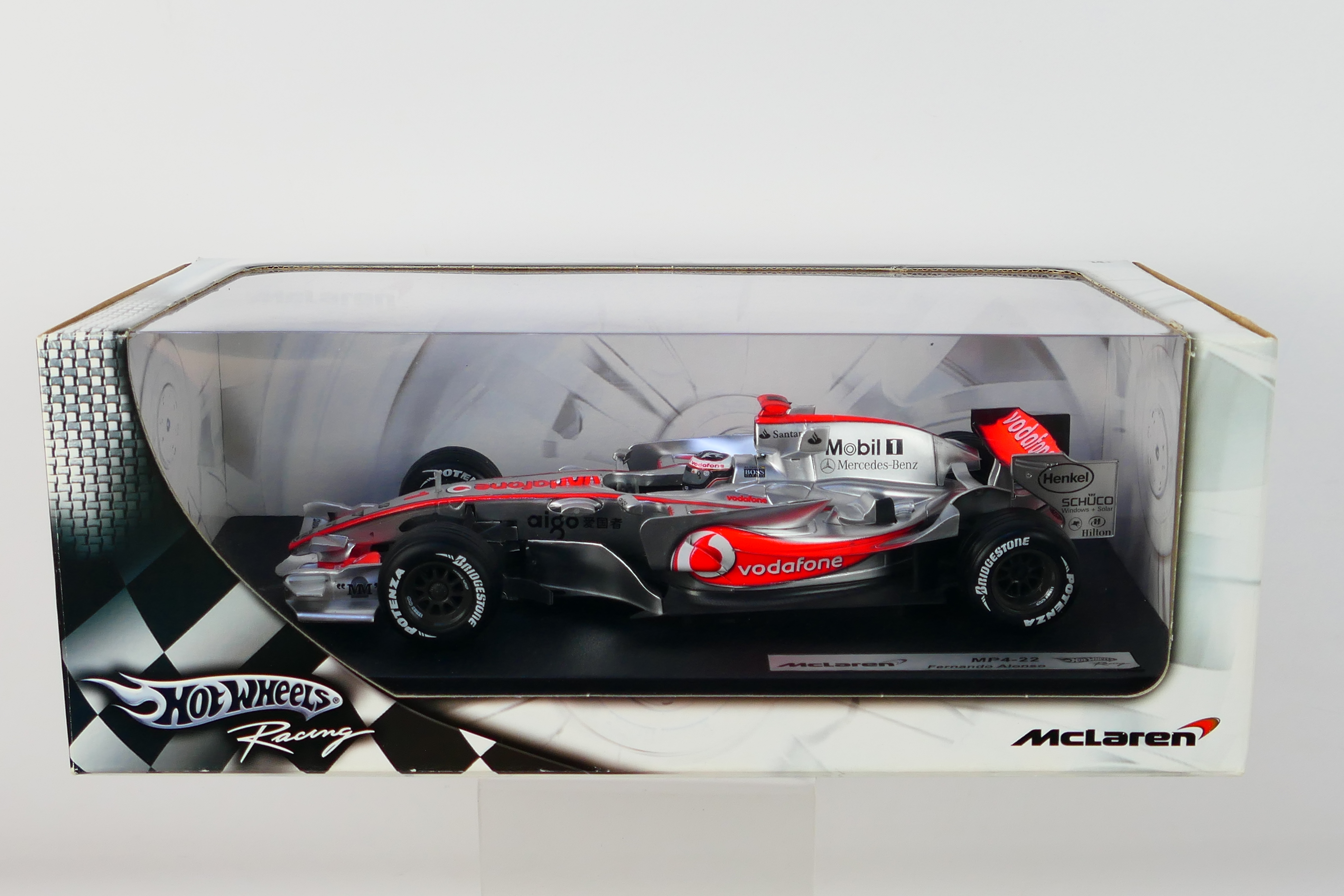 Hot Wheels - A boxed 1:18 scale McLaren MP4-22 Fernando Alonso car which is still factory sealed so