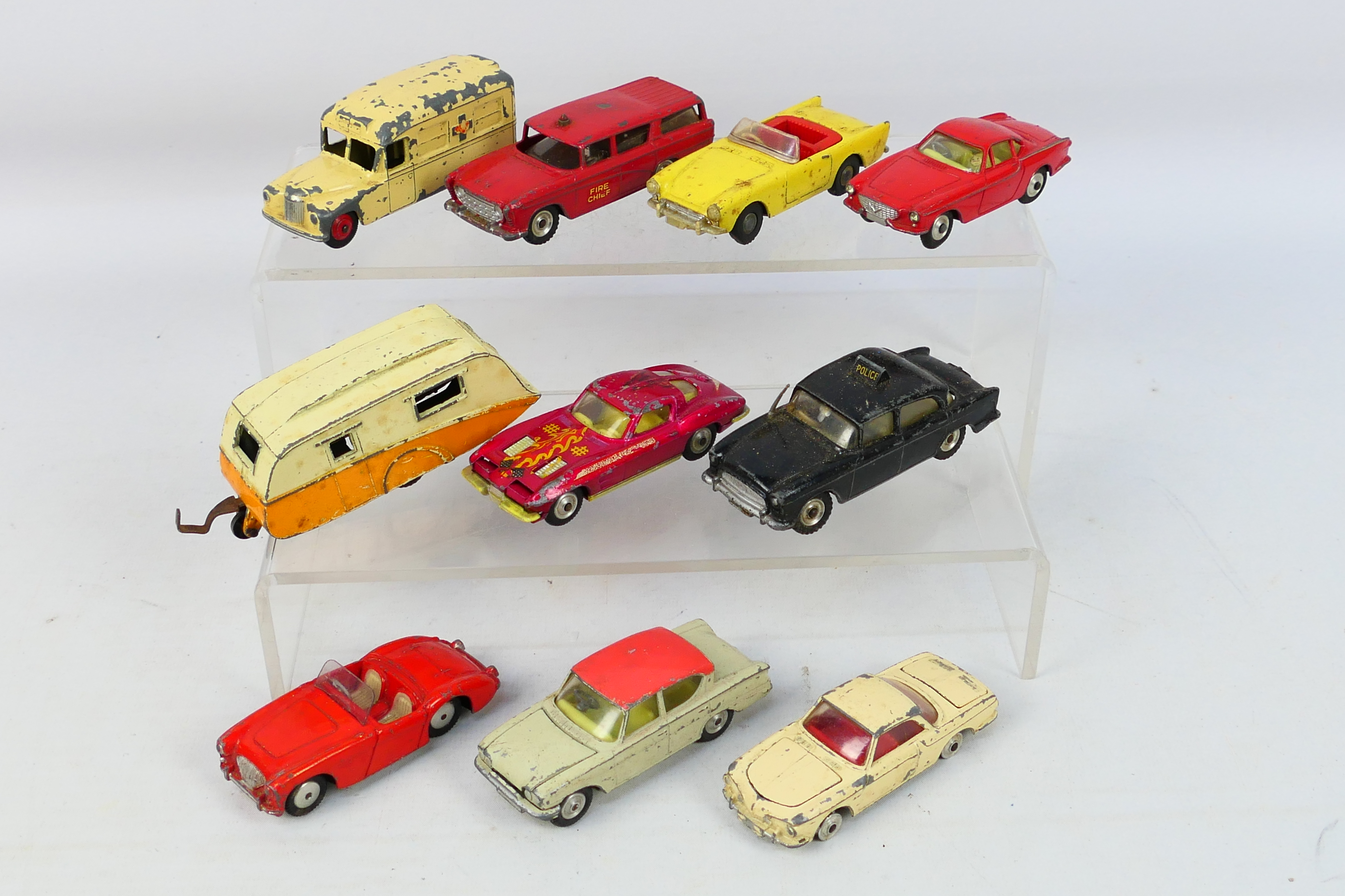 Spot-On - Dinky Toys - Corgi Toys - An unboxed group of 10 playworn diecast model vehicles.