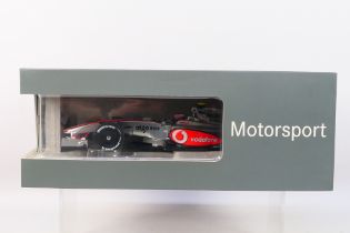 Minichamps - A boxed 1:18 scale Mercedes dealer edition Vodafone McLaren Mercedes MP4-24 Heikki