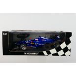 Minichamps- A boxed 1:18 scale Prost Peugeot AP02 Jarno Trulli 1999 car which appears Mint in a
