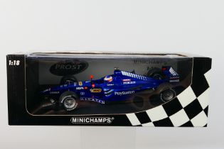 Minichamps- A boxed 1:18 scale Prost Peugeot AP02 Jarno Trulli 1999 car which appears Mint in a